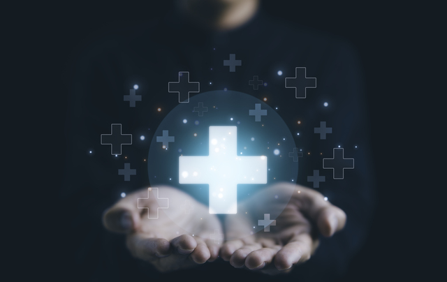 Businessman holding virtual blue plus sign for positive thinking mindset or healthcare insurance symbol concept for mental rejuvenation. Business value added. increase investment growth, benefits add,